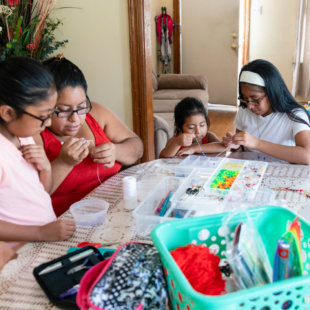 family crafting together to decompress and shed the stress