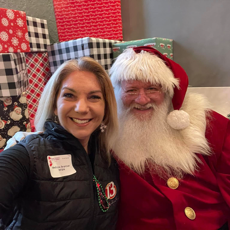 WIBW Melissa Brunner and Santa Claus posing for a selfie